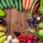 The multicolored vegetables on wooden table